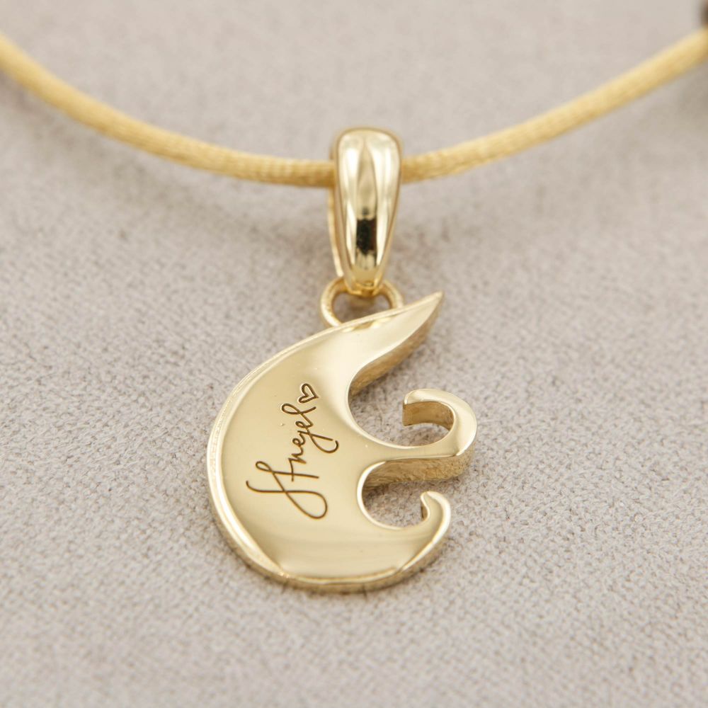 Creazione ciondolo due ori bianco e giallo 18 kt con cuore rovesciato e incisioni personalizzate